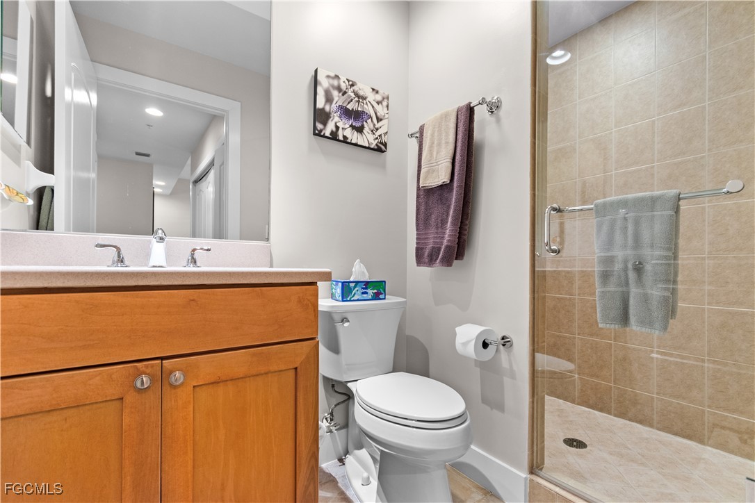 2110 West First Street, Unit 101 Fort Myers, FL 33901 - Photo 14 of 34 a bathroom with a sink a toilet and shower