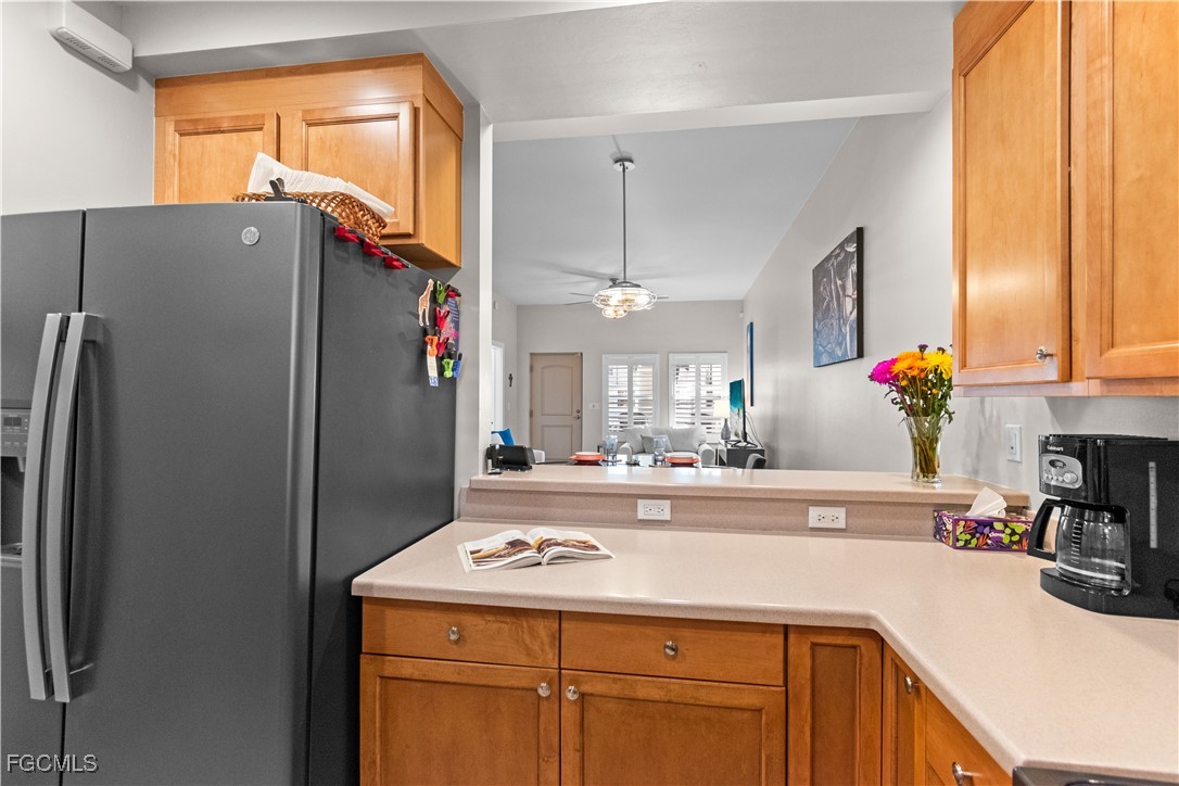 2110 West First Street, Unit 101 Fort Myers, FL 33901 - Photo 15 of 38 a kitchen with stainless steel appliances a sink stove and refrigerator