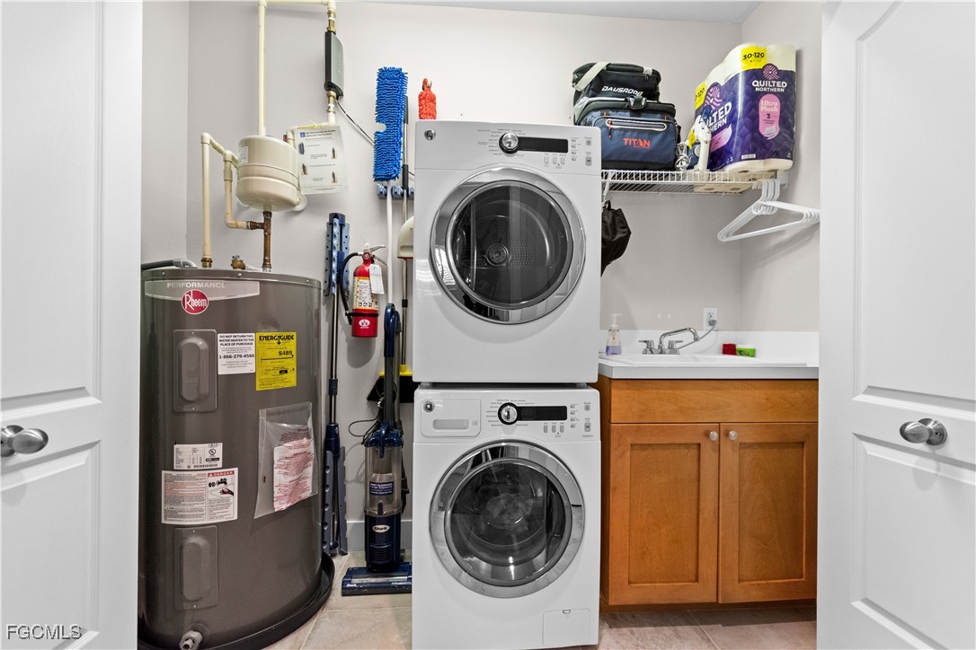 2110 West First Street, Unit 101 Fort Myers, FL 33901 - Photo 17 of 34 a utility room with dryer washer and a view of storage