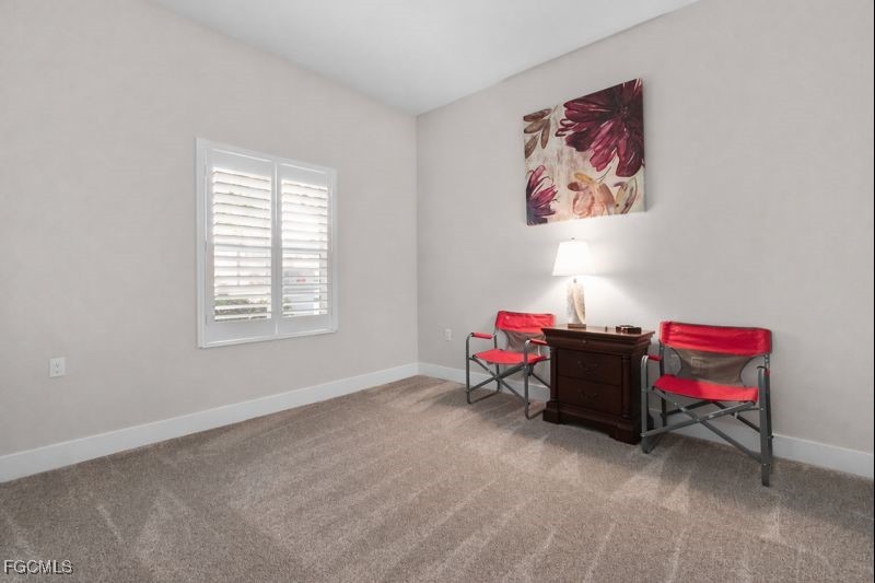2110 West First Street, Unit 101 Fort Myers, FL 33901 - Photo 17 of 38 a bedroom with furniture and a window