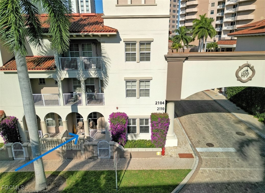 2110 West First Street, Unit 101 Fort Myers, FL 33901 - Photo 24 of 34 a front view of a house with barbeque and outdoor seating
