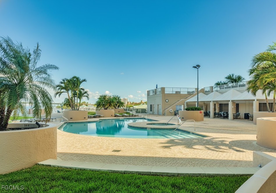 2110 West First Street, Unit 101 Fort Myers, FL 33901 - Photo 27 of 34 a view of a house with a swimming pool