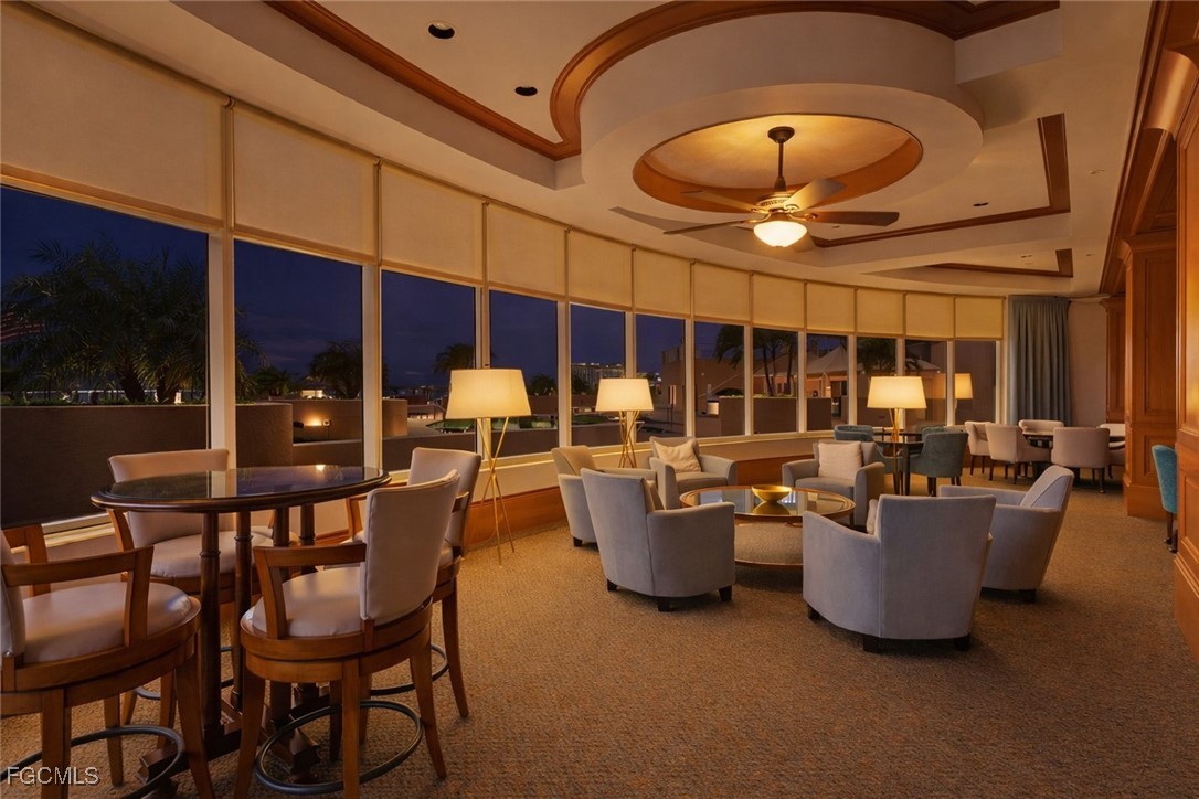 2110 West First Street, Unit 101 Fort Myers, FL 33901 - Photo 33 of 34 a dining room with wooden floor and chandelier