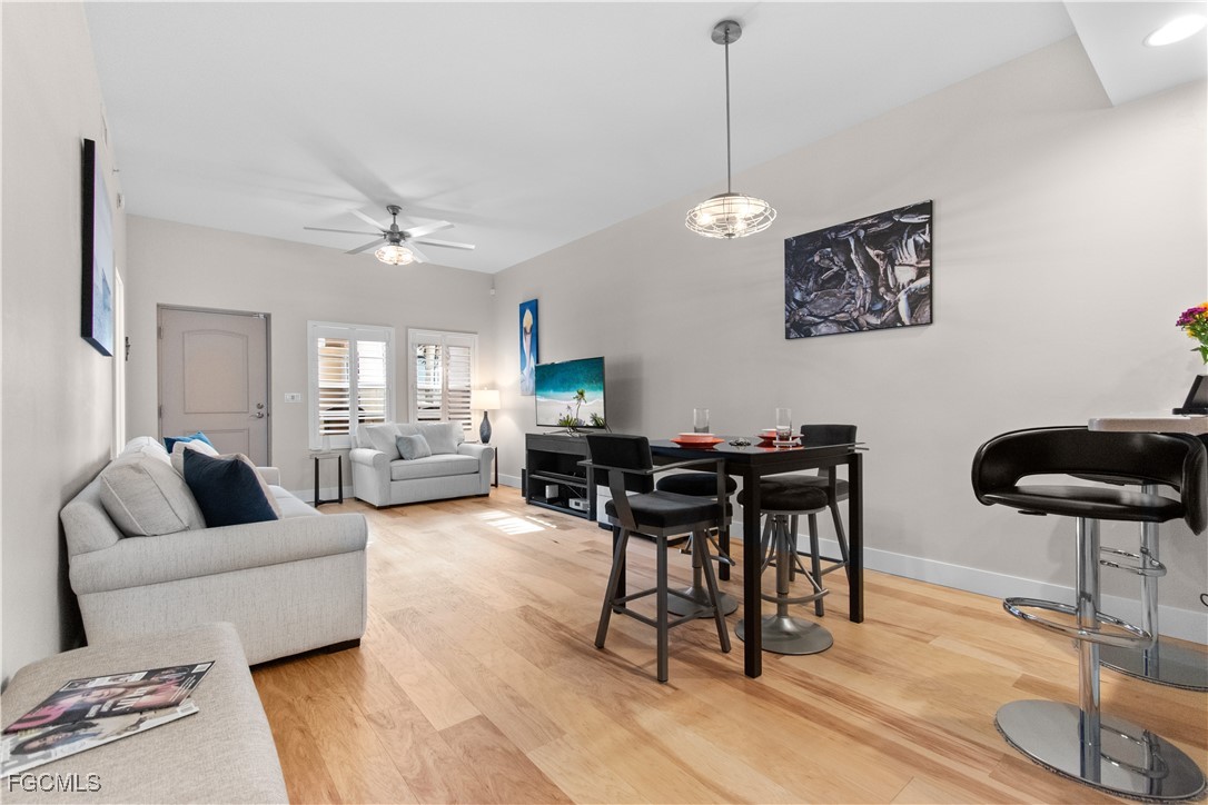 2110 West First Street, Unit 101 Fort Myers, FL 33901 - Photo 4 of 38 a living room with furniture and a large window