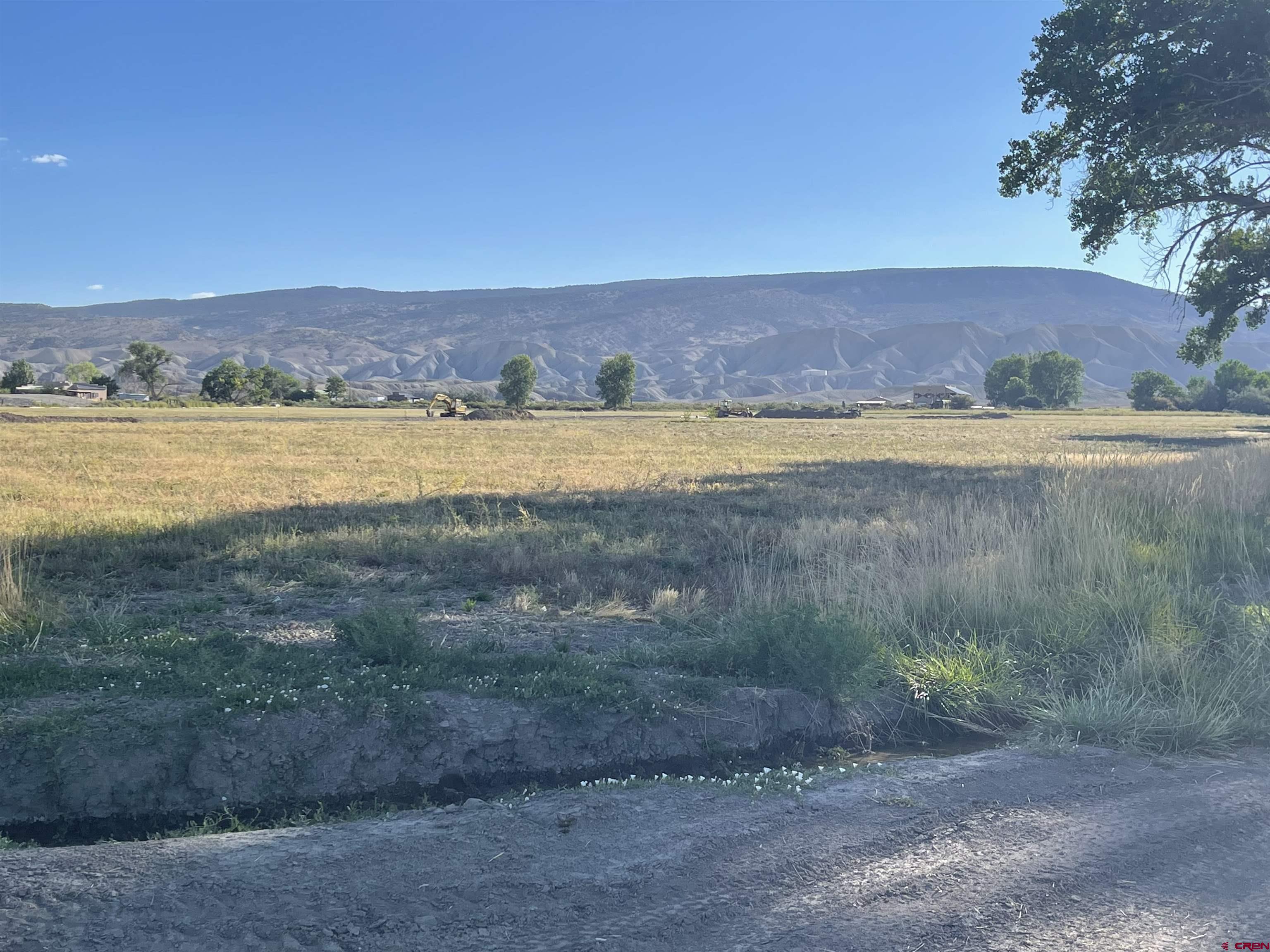 Lot 4 6400th Road Montrose, CO 81401 - Photo 15 of 20 a view of a lake with a yard