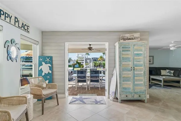 a view of a house with swimming pool and sitting area