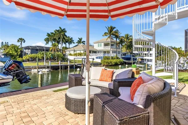 a kitchen with stainless steel appliances kitchen island granite countertop a sink and cabinets