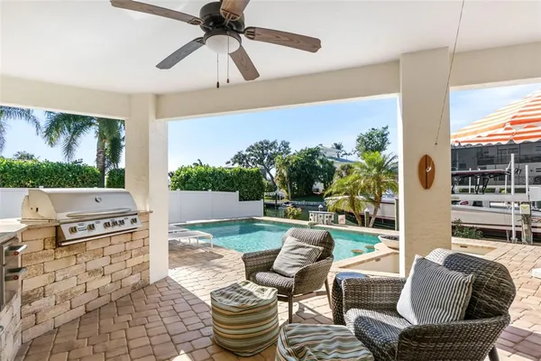 a bedroom with a large bed and a potted plant