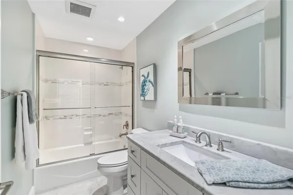 a view of a balcony with wooden floor