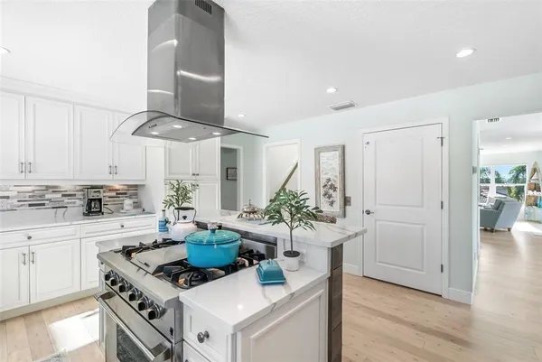 an aerial view of a house with a lake view