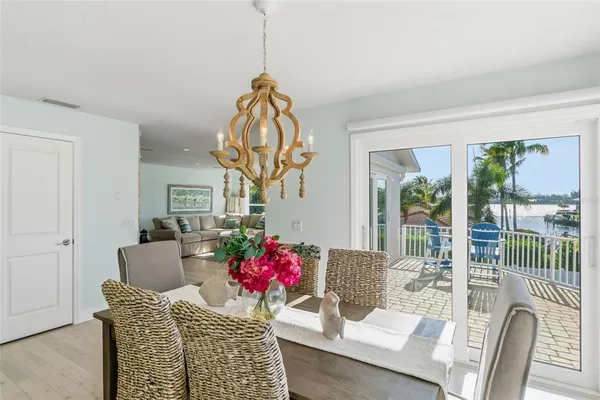 a front view of a house with a garden and trees