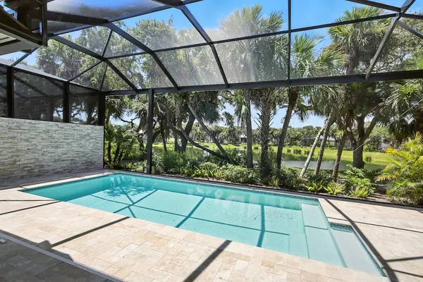 a view of swimming pool with a patio