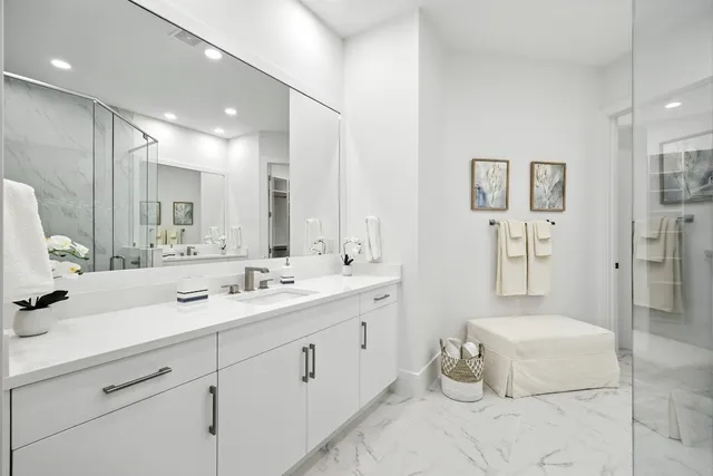a spacious bathroom with a double vanity sink mirror and