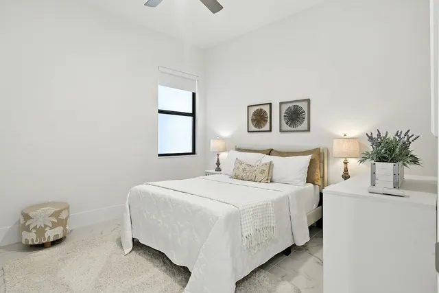 a bedroom with a bed and a couch