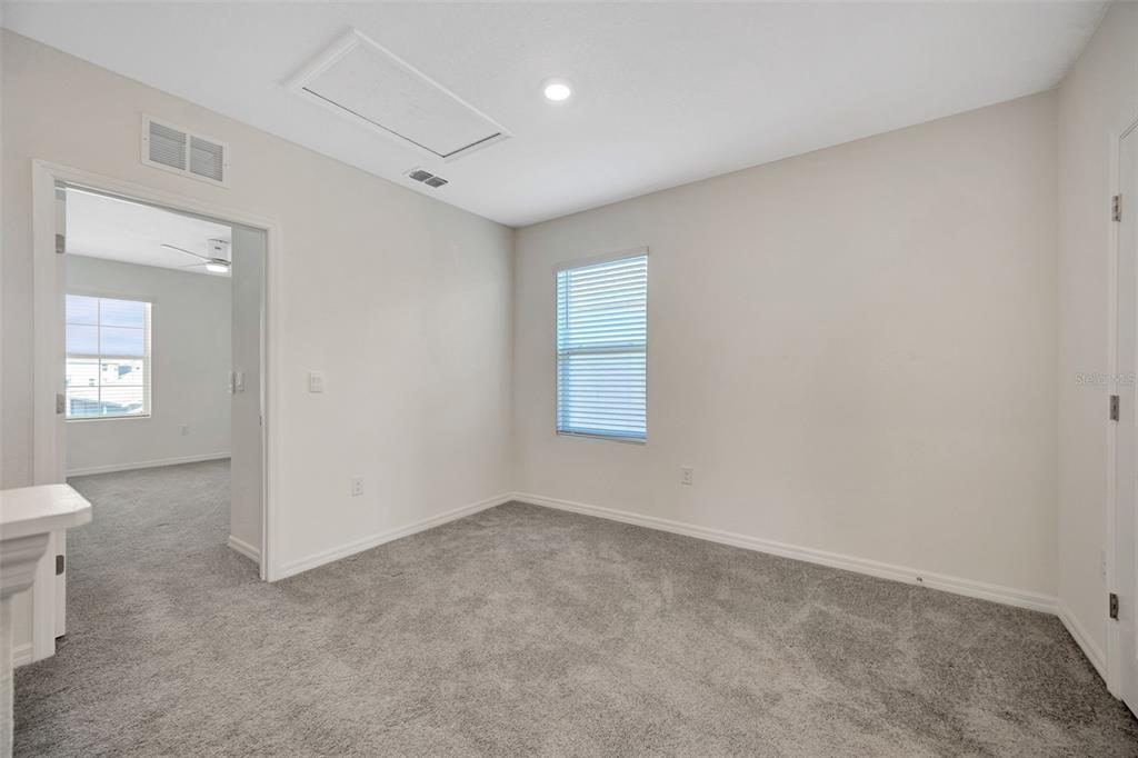 5758 Hollingworth Trail Wesley Chapel, FL 33545 - Photo 19 of 33 an empty room with a white walls and a toilet