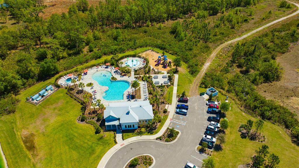 5758 Hollingworth Trail Wesley Chapel, FL 33545 - Photo 26 of 33 an aerial view of a house with a swimming pool