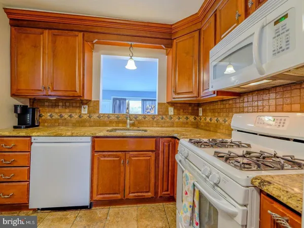 a kitchen with a stove and a sink