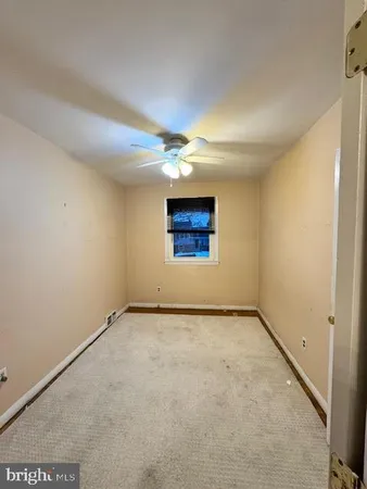 an empty room with a empty space and a window