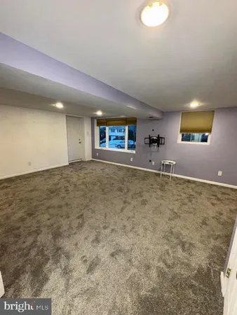 a view of a livingroom with natural light
