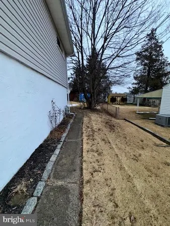 a view of a backyard of the house