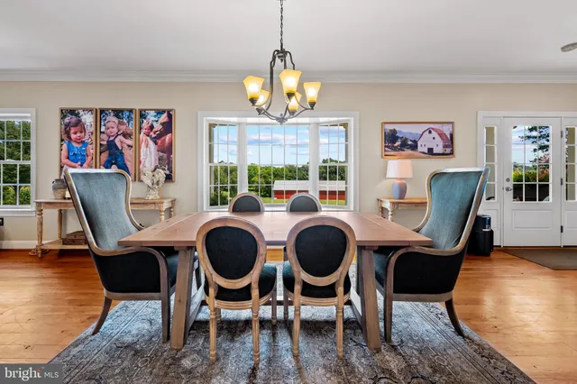 a kitchen with stainless steel appliances kitchen island granite countertop a stove a sink and a refrigerator