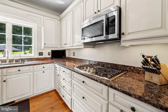a bathroom with a sink toilet and mirror