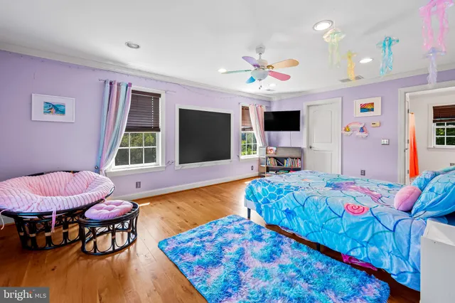 a bed room with a bed and a flat screen tv