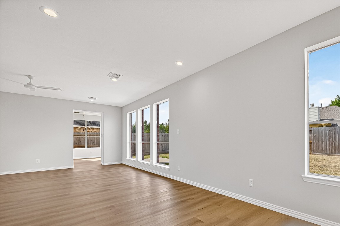 21310 Timber Pines Drive Spring, TX 77388 - Photo 17 of 49 an empty room with wooden floor and windows