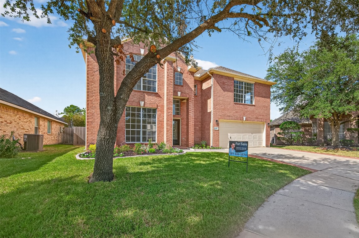 21310 Timber Pines Drive Spring, TX 77388 - Photo 2 of 49 a view of a house with a yard