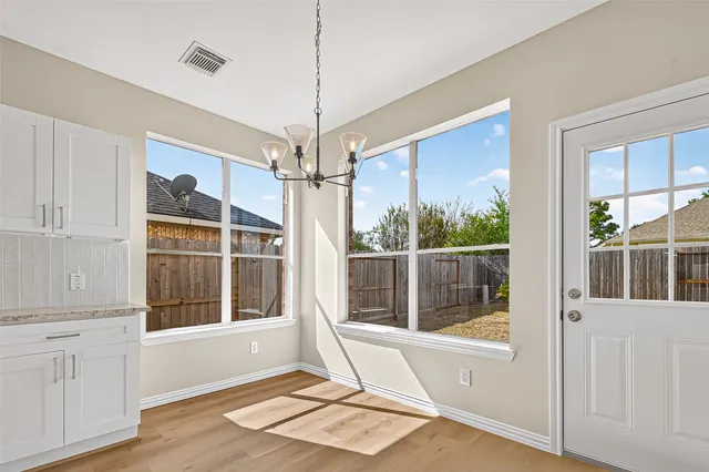 a view of a livingroom with furniture window and wooden floor