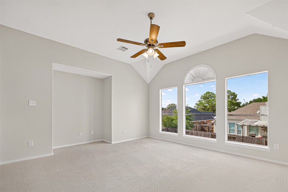 21310 Timber Pines Drive Spring, TX 77388 - Photo 35 of 49 a view of a livingroom with a ceiling fan and window