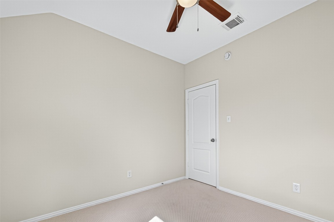 21310 Timber Pines Drive Spring, TX 77388 - Photo 42 of 49 an empty room with a ceiling fan and wooden floor