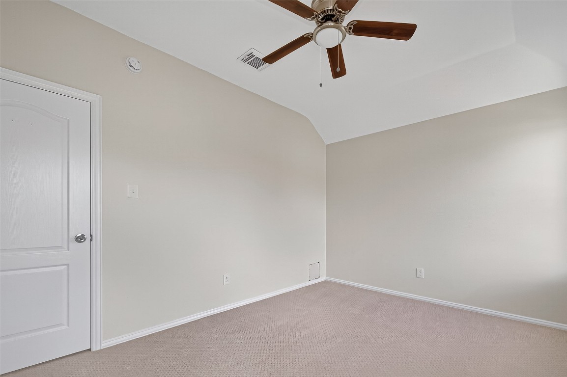 21310 Timber Pines Drive Spring, TX 77388 - Photo 45 of 49 an empty room with a window and a fan