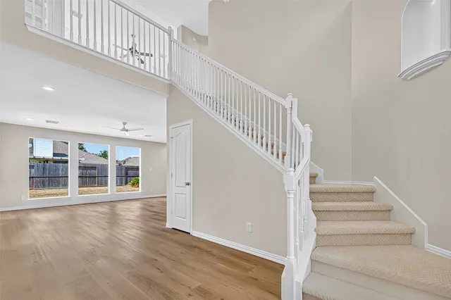 a view of an entryway with wooden floor