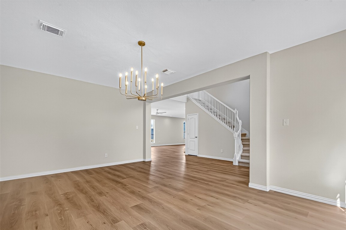 21310 Timber Pines Drive Spring, TX 77388 - Photo 10 of 49 wooden floor in an empty room with a window