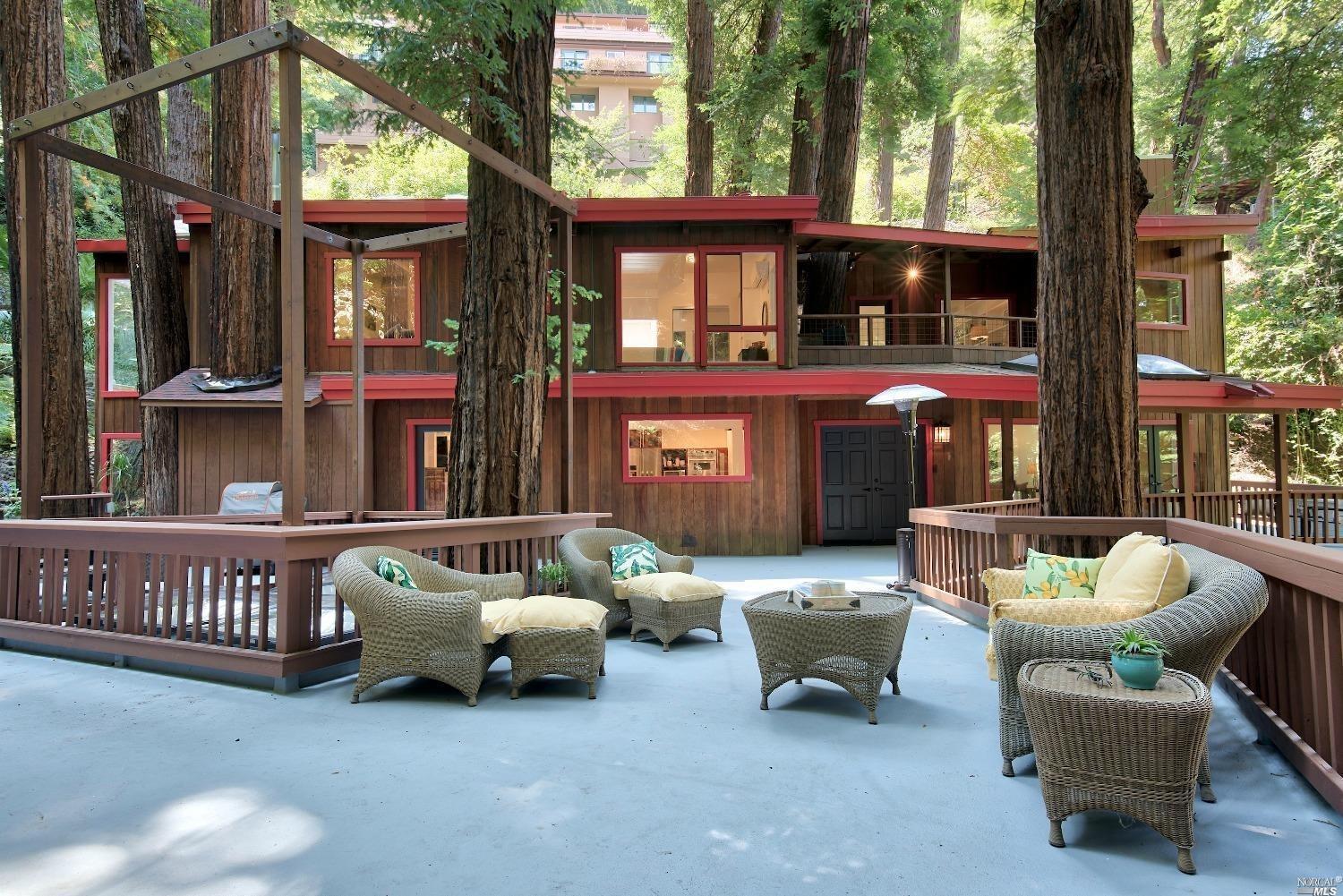 a building outdoor space with patio furniture and potted plants