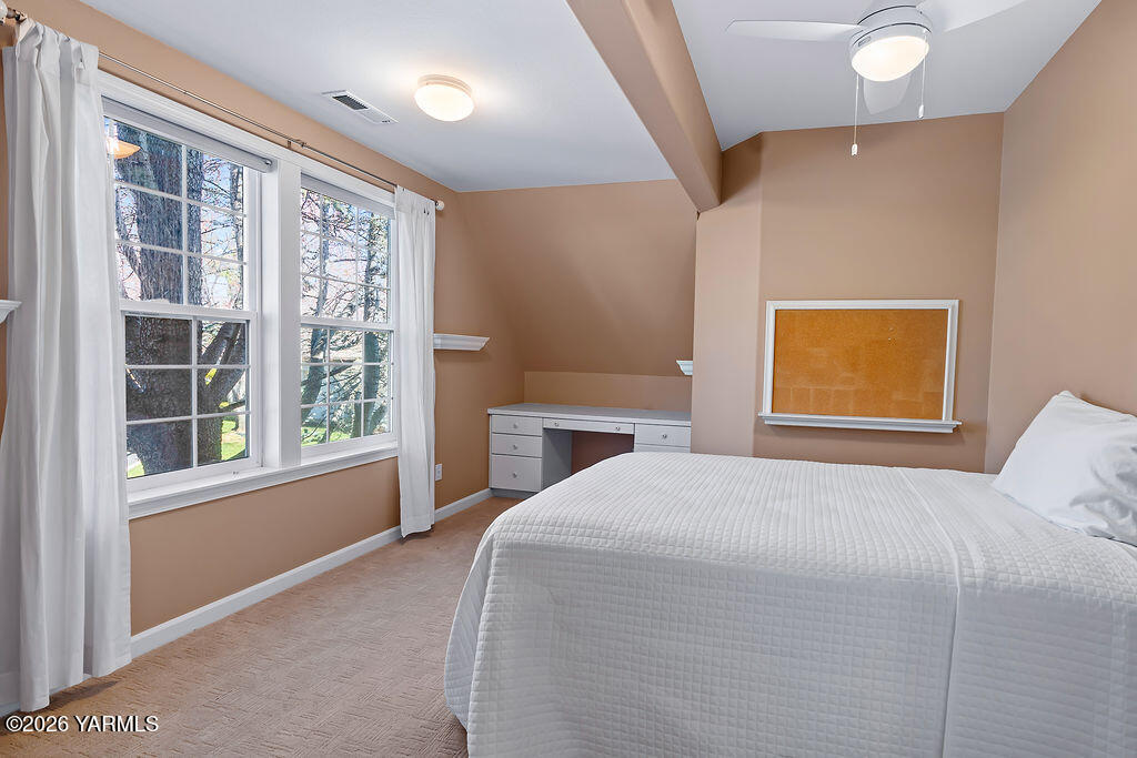 6810 Ravens Gate Way Yakima, WA 98908 - Photo 27 of 49 a bedroom with a bed and a window
