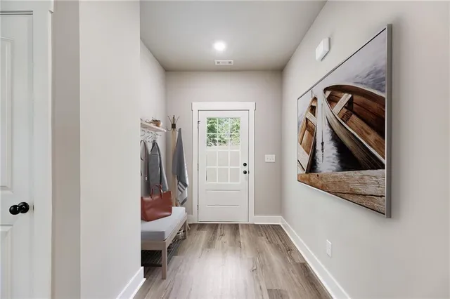 a view of a hallway with front door