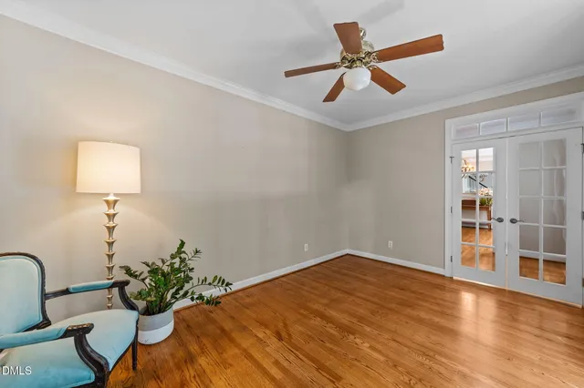 a workspace with a table & a chandelier