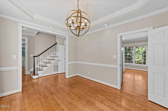 a view of an entryway with wooden floor