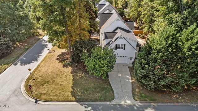 a view of a house with a yard garage and sitting area
