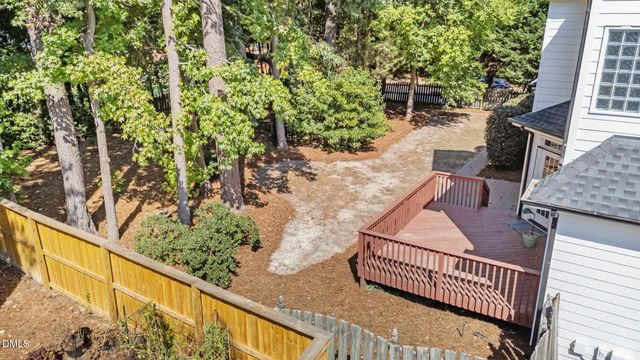 a balcony with wooden floor and outdoor seating