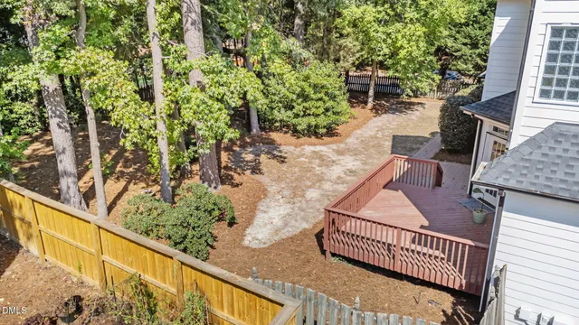 a balcony with wooden floor and outdoor seating