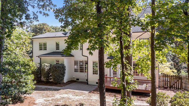 a view of a house with a tree