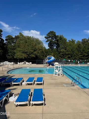 a view of a swimming pool with chairs