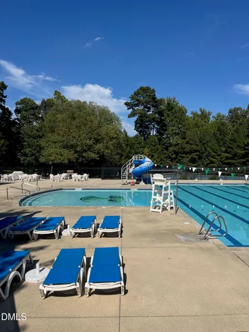 a view of a swimming pool with chairs
