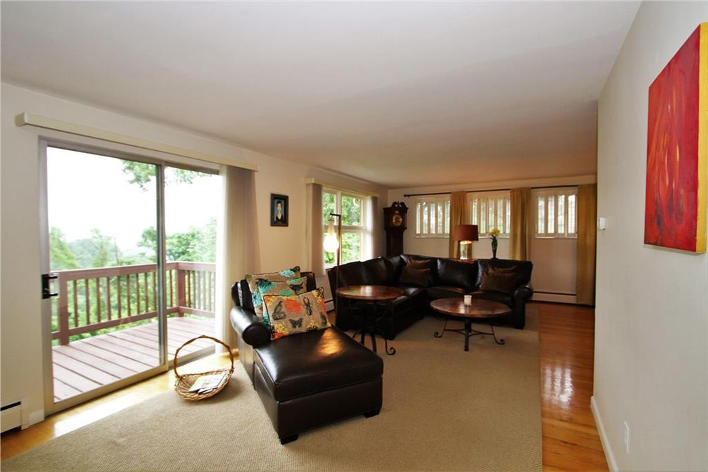 245 Tech Road Thornburg, PA 15205 - Photo 7 of 25 Living room with access to balcony.