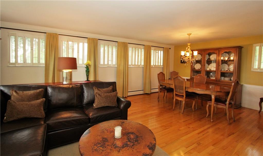 245 Tech Road Thornburg, PA 15205 - Photo 9 of 25 Dining area open to living room. Wall of window with plantation shutters.