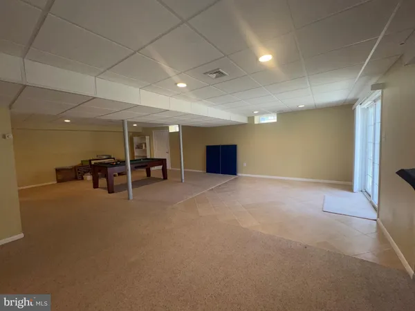a view of an empty room with a sink