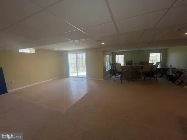 a living room with furniture window and a table